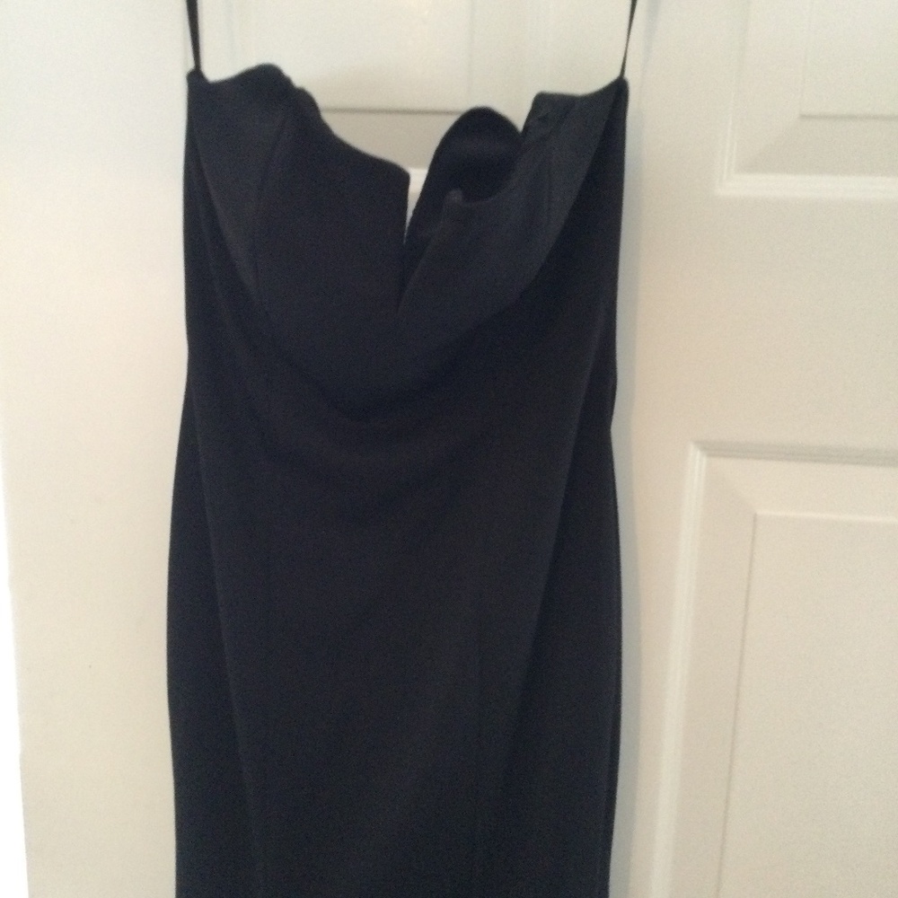 Strapless black evening dress by Jovani.  Size 6, 100 % polyester for dress.